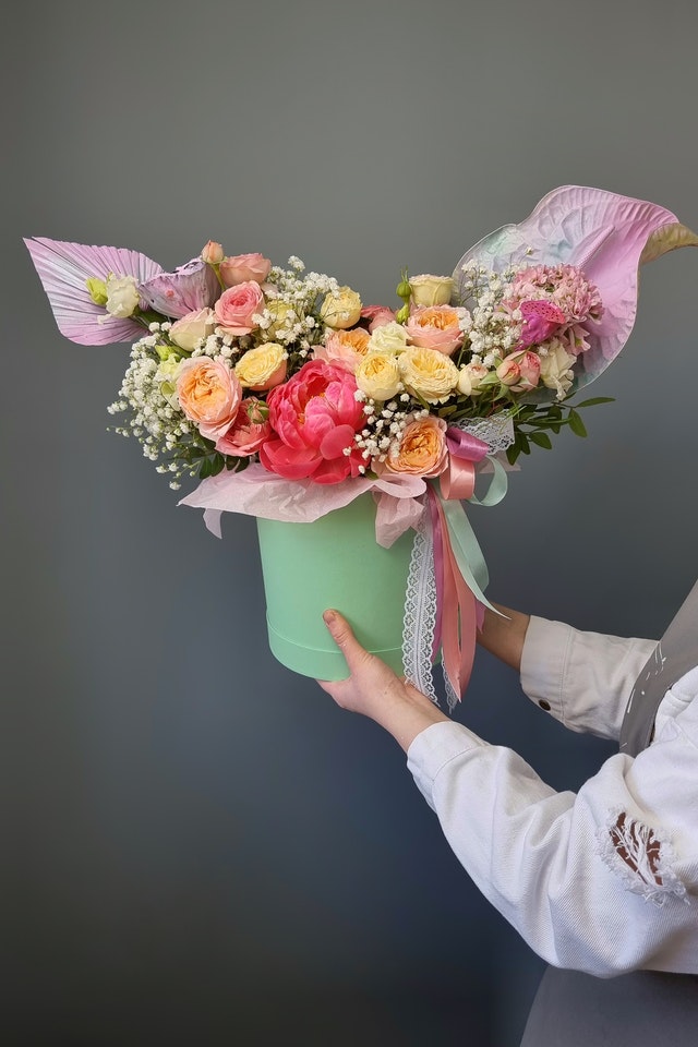 boxed bouquet peach cream and pink roses 