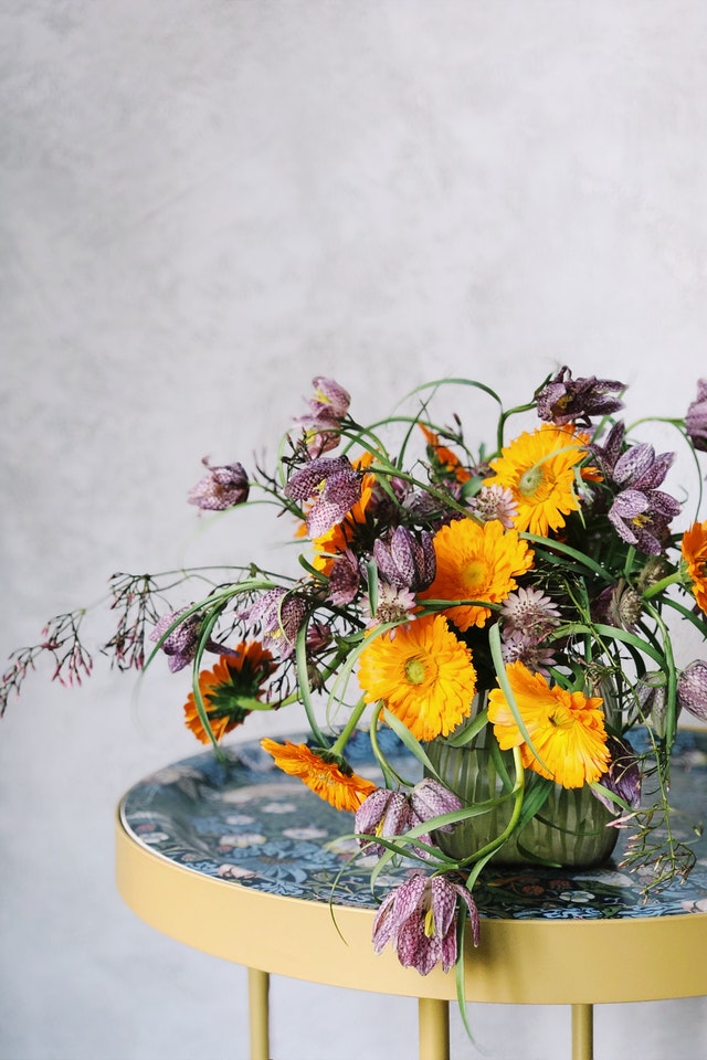 Orange and Purple corporate flower arrangement