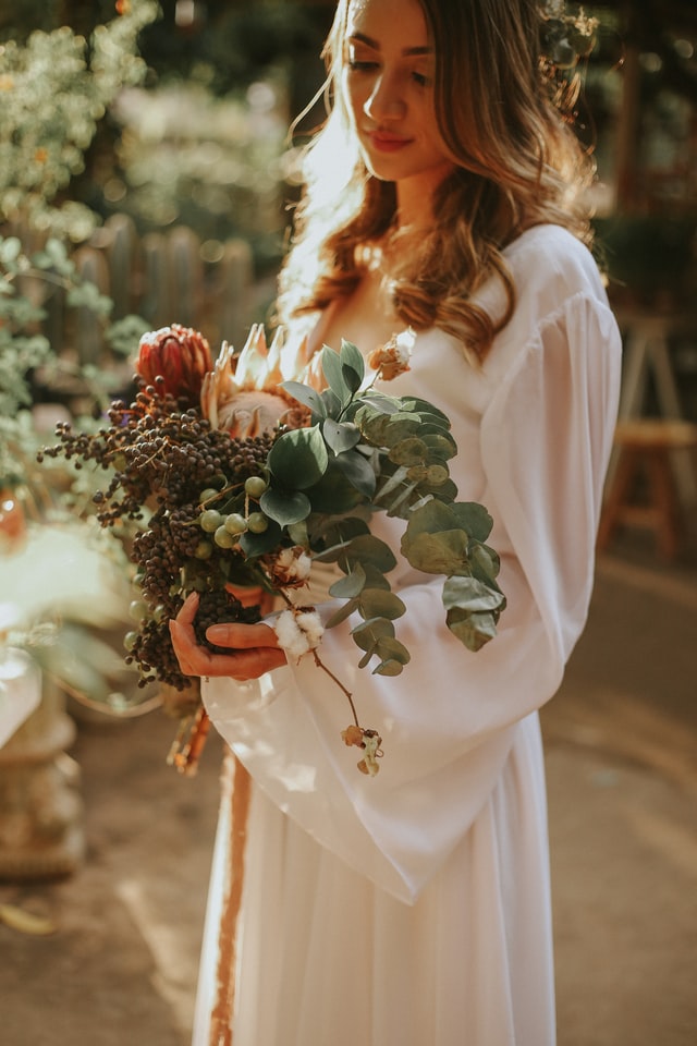 Bride holding a Native Protea bouquet